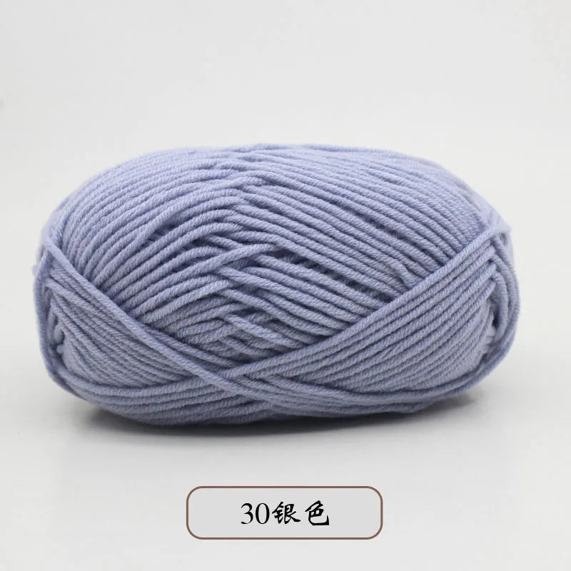 A ball of light purple pre-dyed milk cotton yarn used for knitting and crochet.