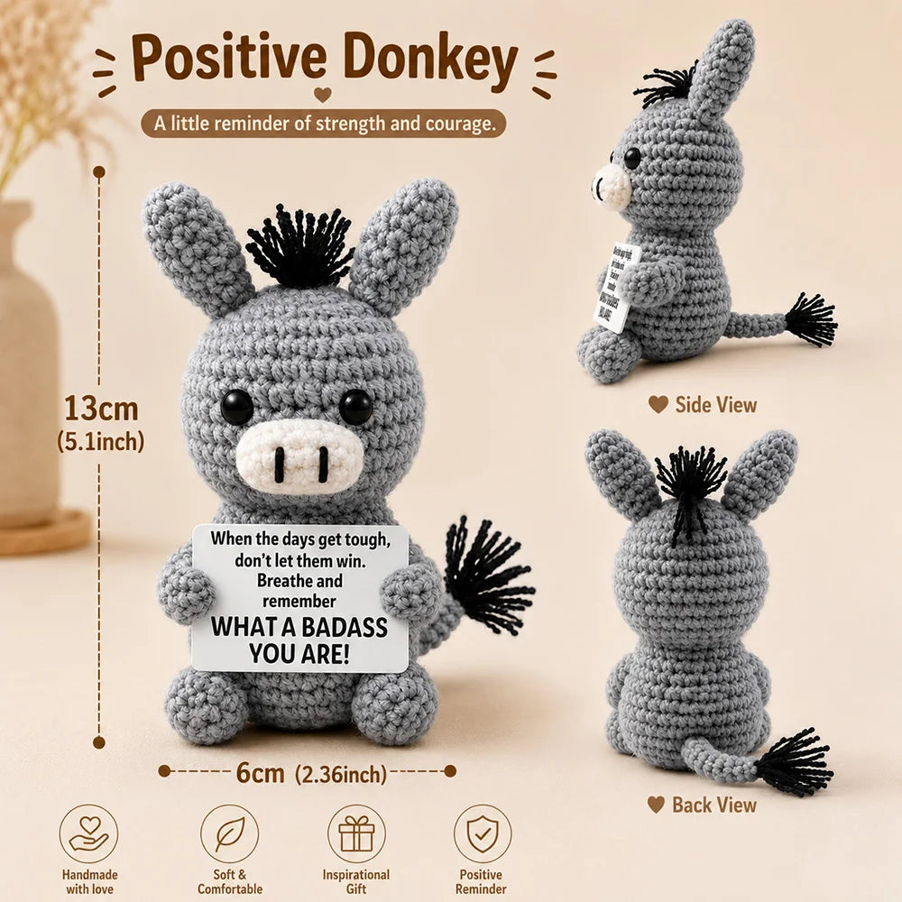 A handmade crochet donkey doll in gray with a motivational card, shown from multiple angles.