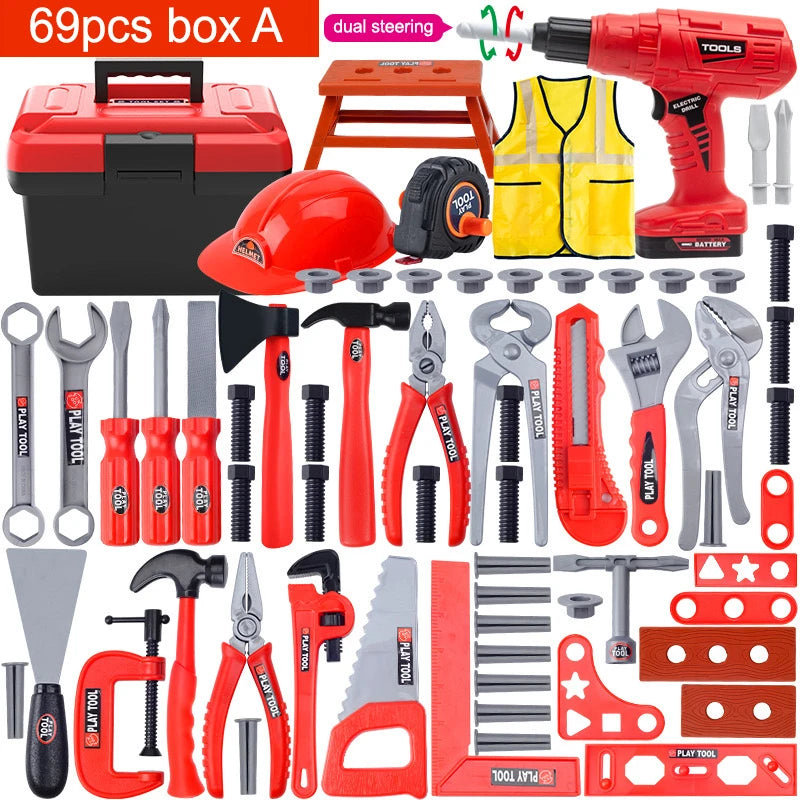 A collection of red and black battery-powered toy tools including a drill, screwdriver, pliers, and various hand tools in a b