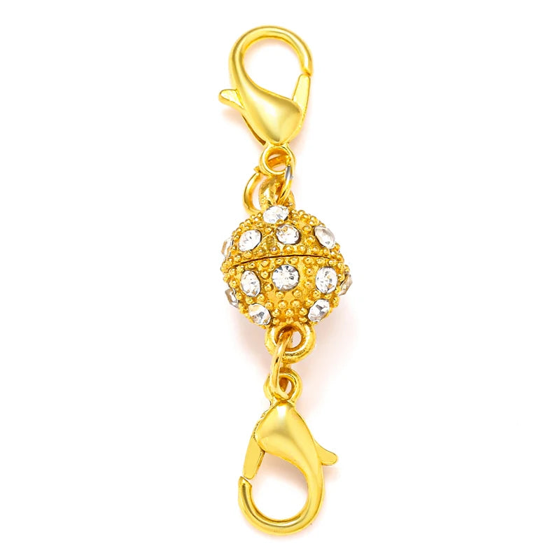 A gold-colored magnetic lobster claw clasp used for jewelry making.