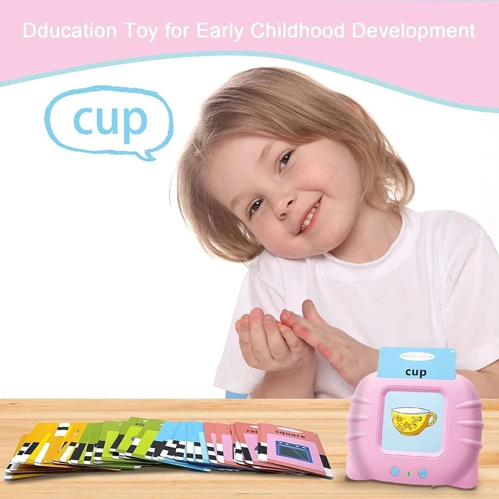 A young girl is holding a pink educational cup toy and a set of colorful flash cards.