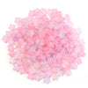 A pile of pink and purple transparent star acrylic beads for jewelry making