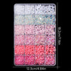 A tray of pink and white resin rhinestones and pearls for DIY crafts, arranged in various colors and sizes.
