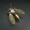 A detailed steampunk mechanical bee model kit featuring intricate metal parts and brass components.