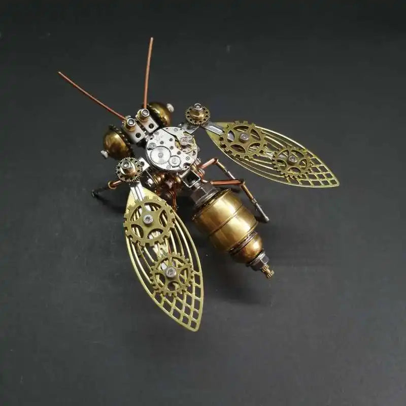 A detailed steampunk mechanical bee model kit featuring intricate metal parts and brass components.