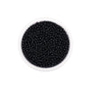 A clear container filled with black round glass seed beads for jewelry making
