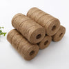 Rolls of natural brown jute twine used for crafts, gift wrapping, and DIY projects