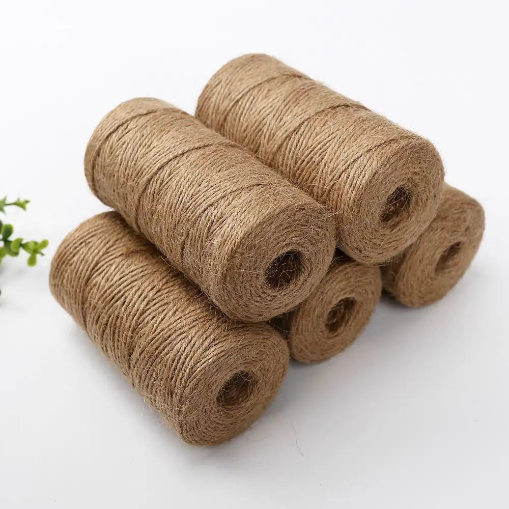 Rolls of natural brown jute twine used for crafts, gift wrapping, and DIY projects
