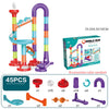A set of colorful marble run building blocks including vertical tracks, ramps, and various accessories.