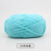 A ball of light blue pre-dyed milk cotton yarn used for knitting and crochet.
