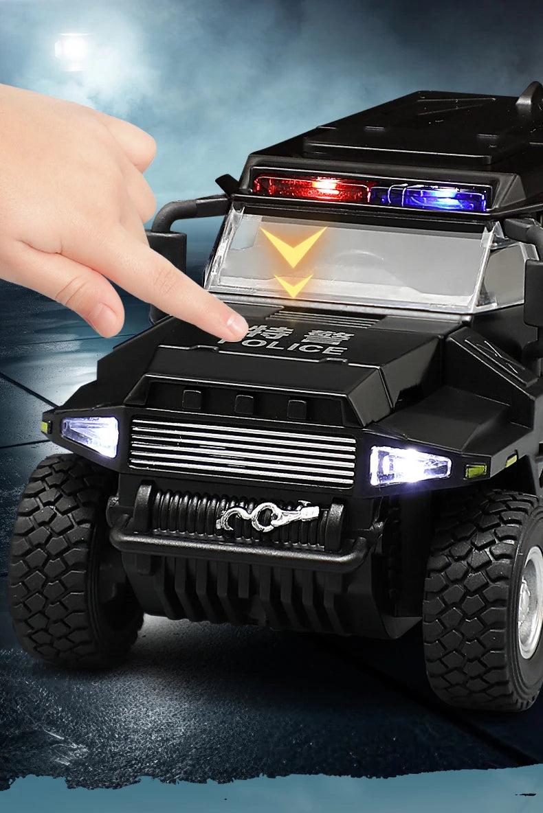 A hand points at a black SWAT City Police truck diecast toy with flashing lights.