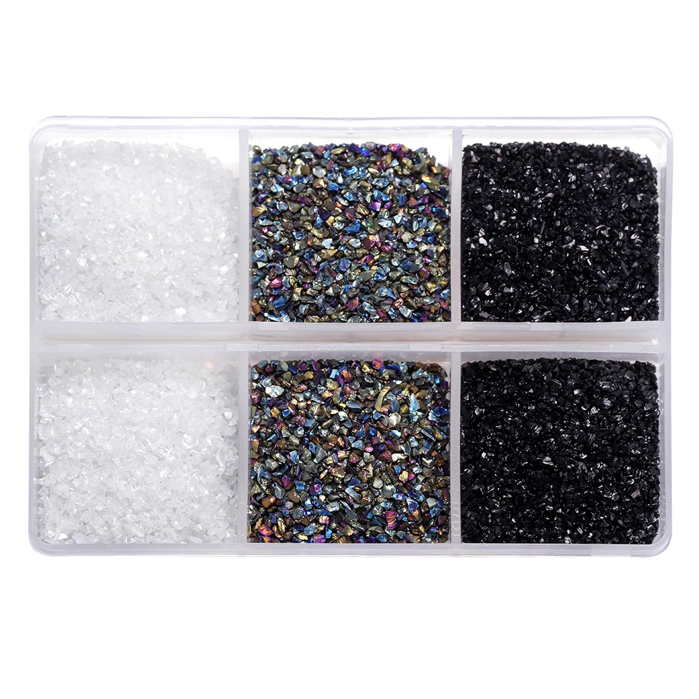 A clear plastic container holds three types of crushed glass stones: white, multicolored, and black.