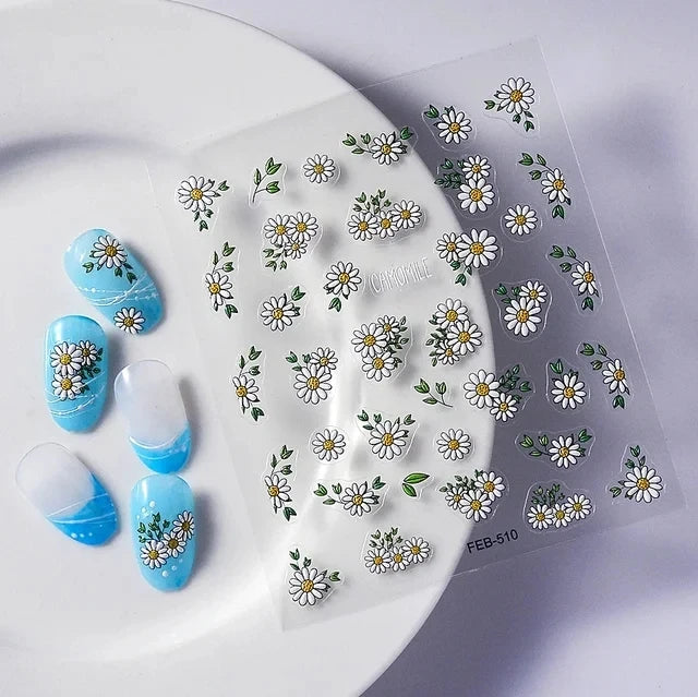 A sheet of 5D Bronzing Gothic nail art stickers featuring various floral and leaf designs on a white plate.