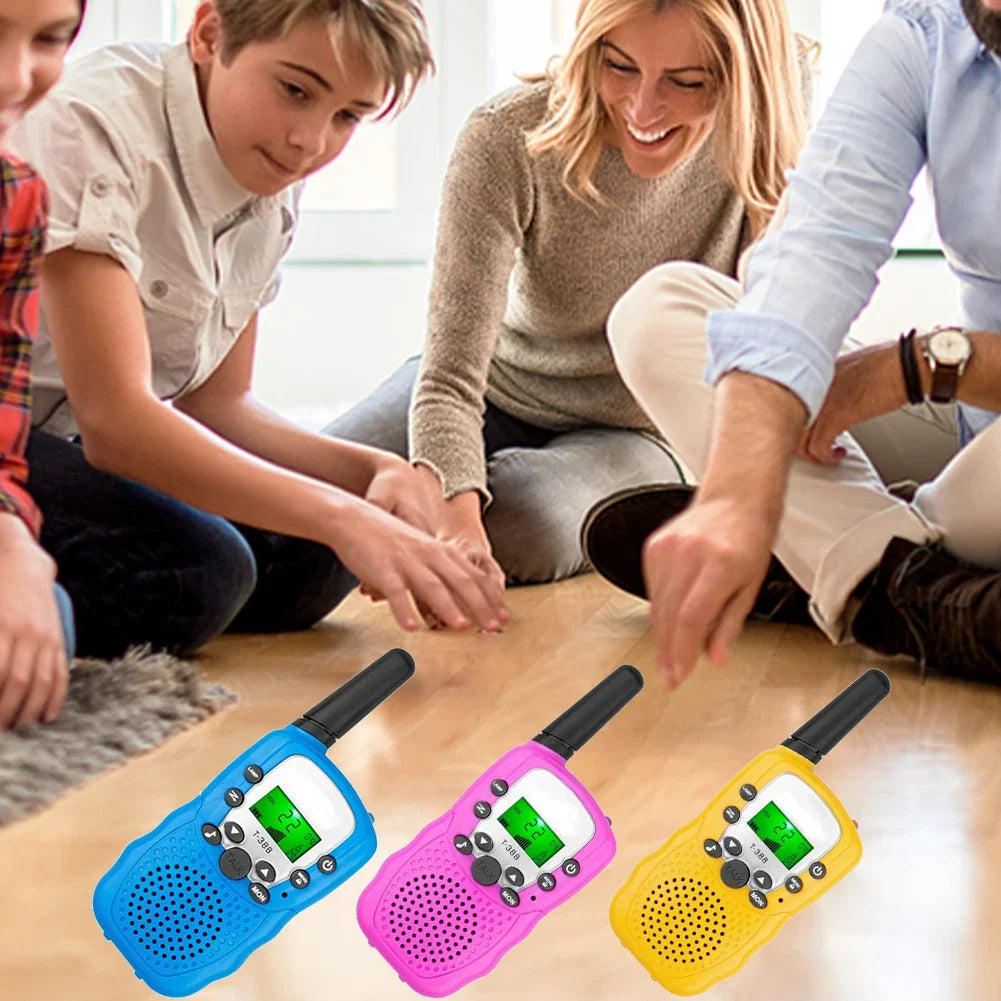 A set of three colorful mini walkie talkie radios for kids, including blue, pink, and yellow models.
