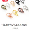 A collection of various gold and silver flattened chain connectors for jewelry making.