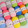 A collection of brightly colored soft chenille yarn balls in various shades including pink, green, orange, and blue.