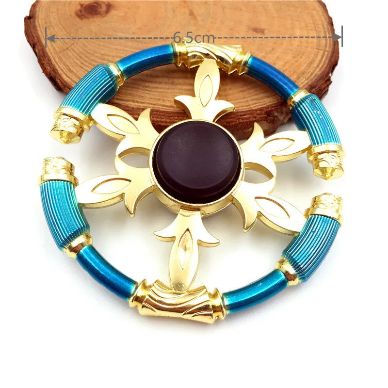 A metal fidget spinner featuring a gold-colored cross design with blue iridescent finish.