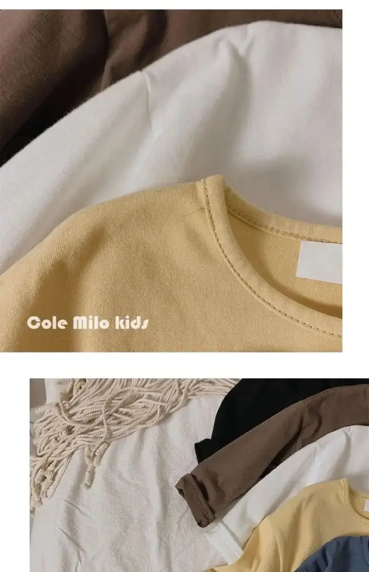 A yellow long sleeve cotton tee for kids displayed on a white background.