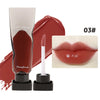 A tube of dark mirror lip glaze and a wand applicator for Maxfine 03 shade on a white background.