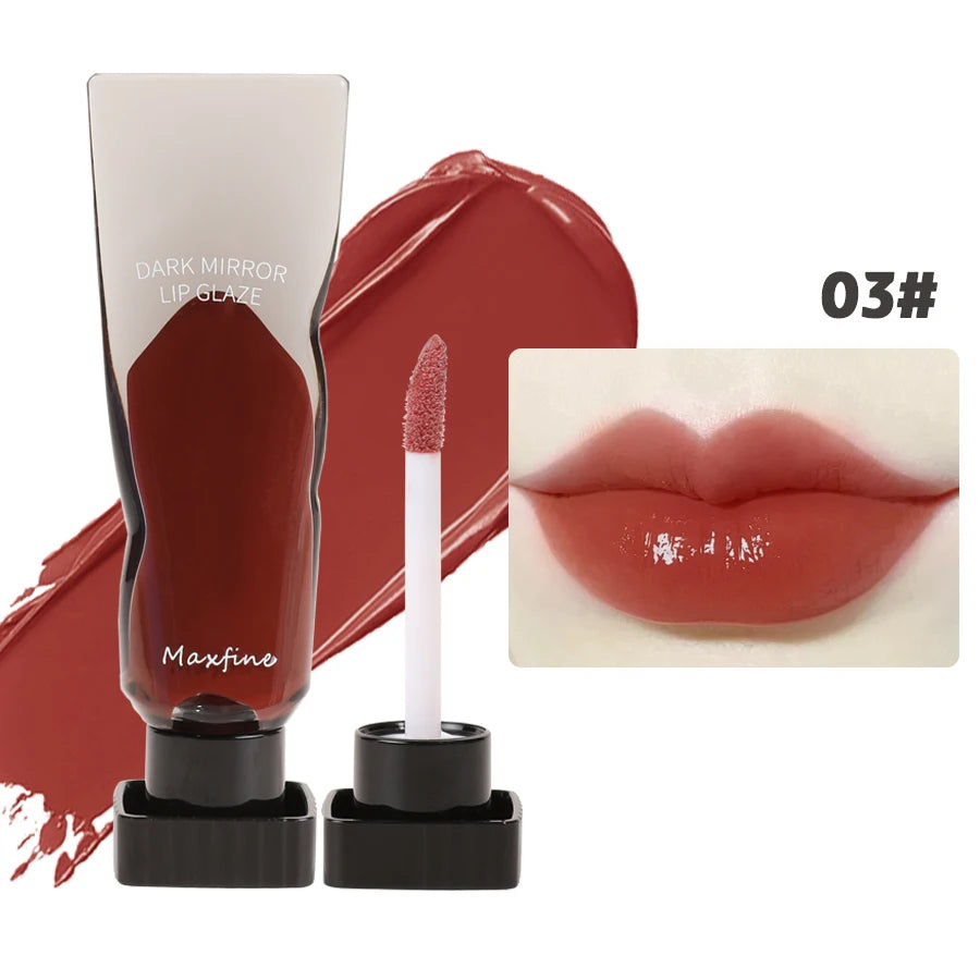 A tube of dark mirror lip glaze and a wand applicator for Maxfine 03 shade on a white background.