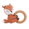 A crocheted fox toy with a wooden ring, used as a baby rattle and teether.