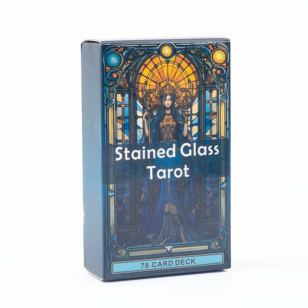 A box of the Stained Glass Tarot card deck featuring an ornate design with a central figure and stained glass elements.