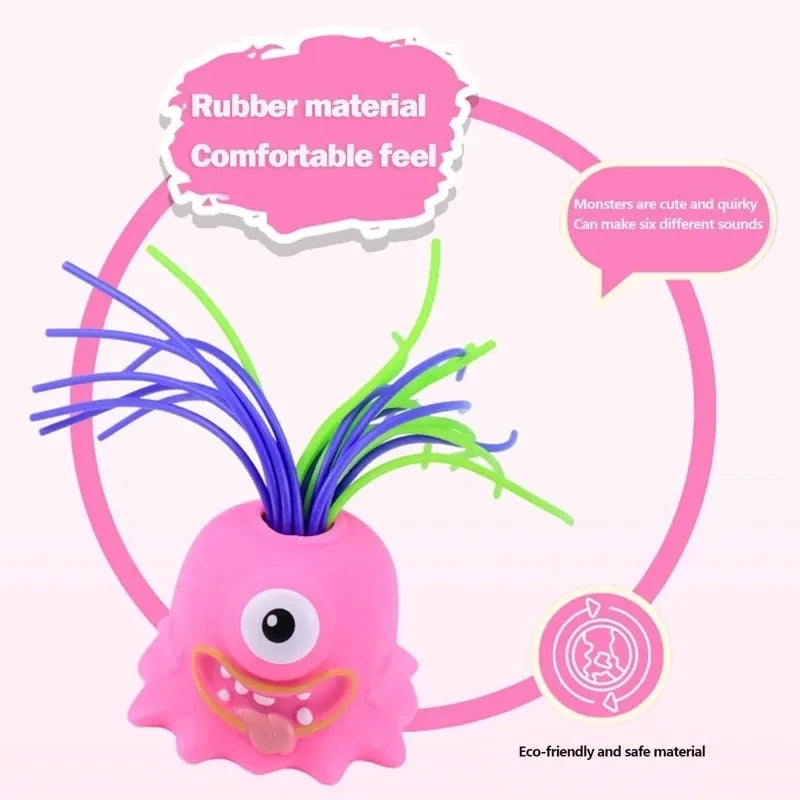 Pink rubber monster toy with purple and green hair used for stress relief