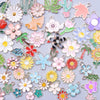 Assortment of gold-tone enamel charms featuring various flowers and cacti for jewelry making