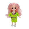 A pink Articulated BJD princess doll wearing a lime green shirt with a smile design.