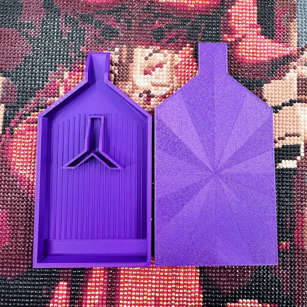 A purple diamond painting tray with a pop-up plug for bead sorting set against a colorful background.