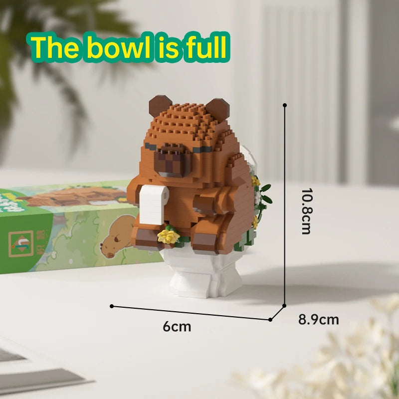 An orange capybara building block model is shown standing on a white base, with text indicating the bowl is full.