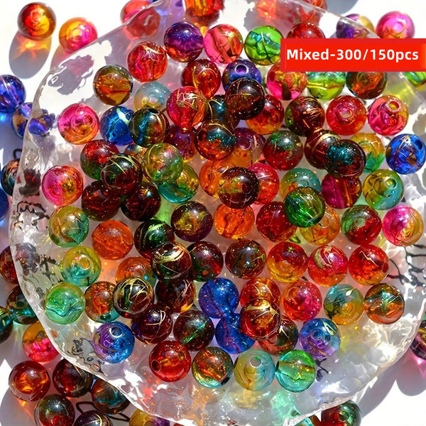 A pile of mixed colorful acrylic beads in various shades of red, green, blue, and yellow.