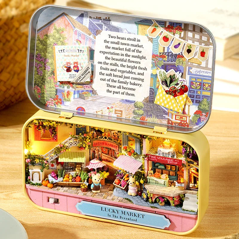 A detailed wooden miniature dollhouse market scene featuring stalls and colorful produce.