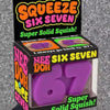 Box of Nee Doh Six Seven purple squish toy with a hand squeezing it.