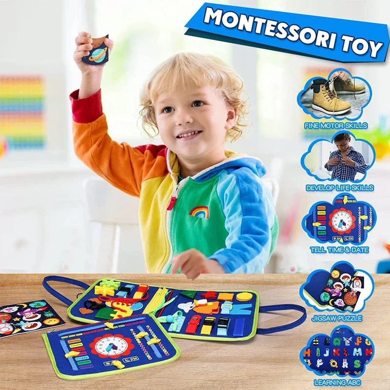 A smiling toddler holds up a Montessori felt activity busy book with a dinosaur theme on a wooden table.