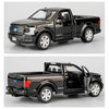 A black Ford F150 SVT Raptor 1:36 diecast model truck shown in side profile.