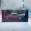 A die-cast model of a red 1959 Chevrolet Impala car displayed in its packaging.