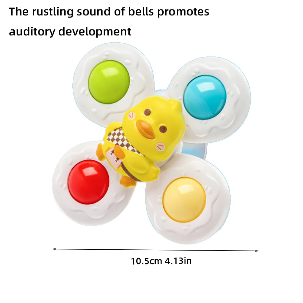 A set of colorful, round bath toys with yellow, red, and blue accents for toddlers.