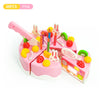 Pink pretend play birthday cake tea set with various pink and yellow food items and a pink knife