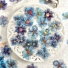 A collection of blue and purple floral hot stamp stickers for journaling and scrapbooking