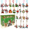 A collection of Christmas-themed diamond painting keychains and charm pendants in various colors and designs.
