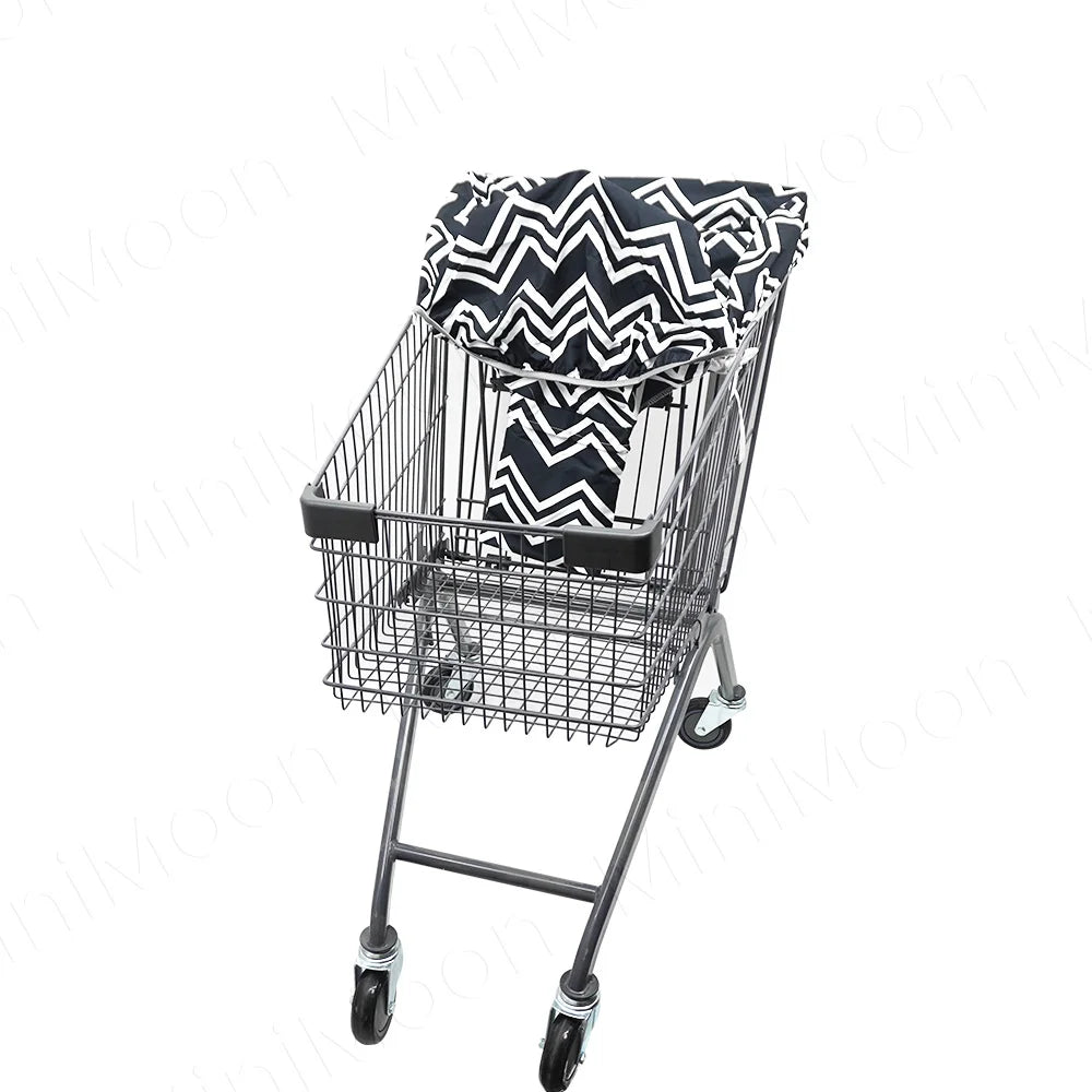A black wire shopping cart with a patterned fabric seat cover for babies and toddlers.