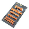 A plastic package containing decorative motorcycle screw cap covers for engine components.