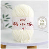 A ball of white chenille yarn with a pink label featuring Chinese characters for knitting and crochet