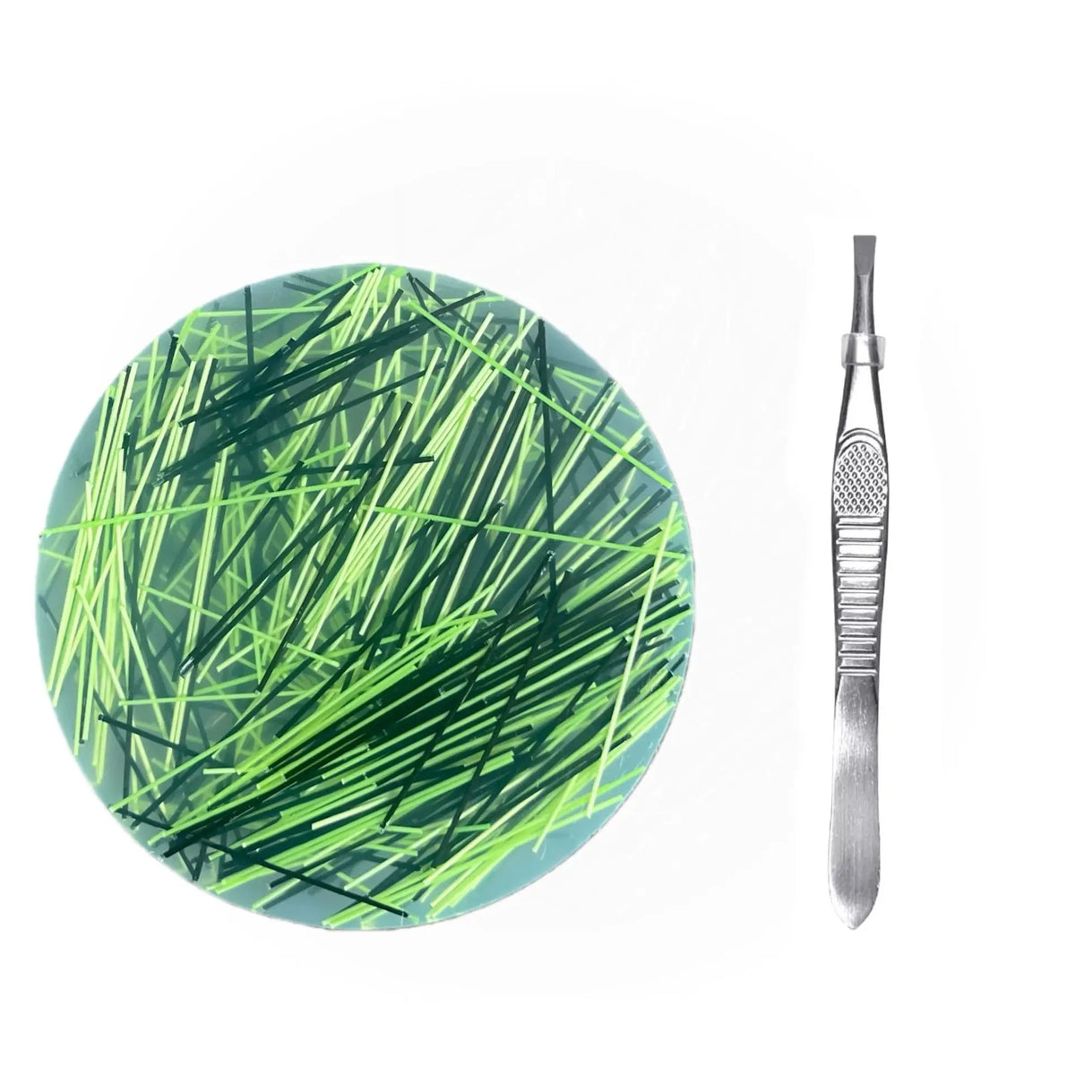A circular silicone fidget picking pad with green lines and a metal tweezer tool.