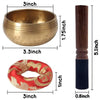 A handcrafted Tibetan singing bowl with a brass bowl, wooden mallet, and silk cushion.