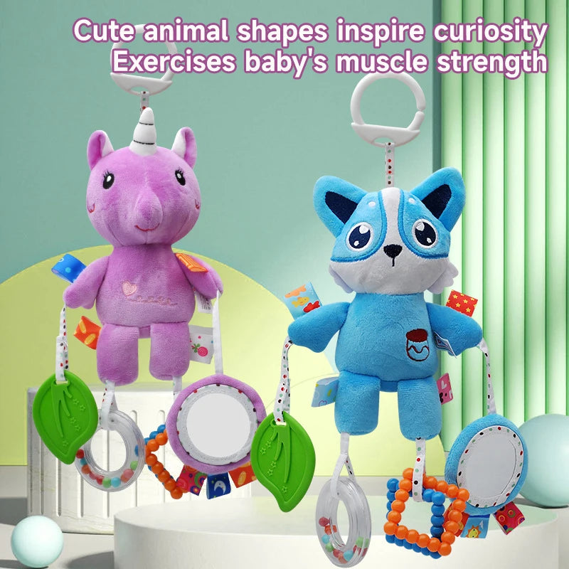 A purple unicorn plush toy is hanging with various colorful rattles and toys for baby muscle exercises.
