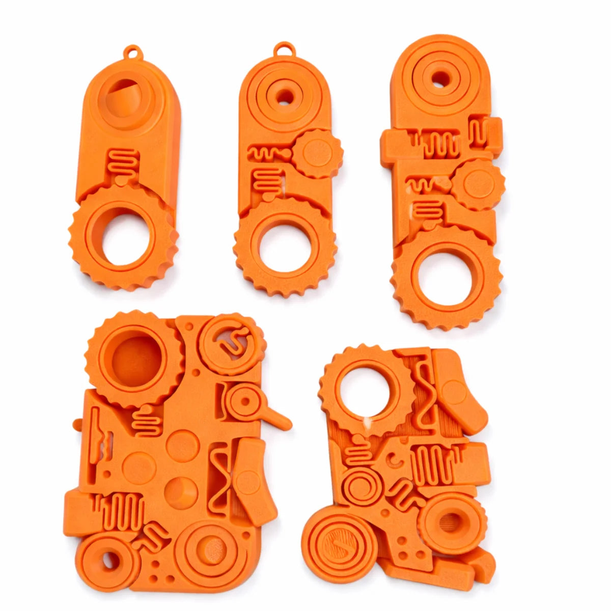 Orange 3D printed fidget toys including a clicker, spinner, and various textured pieces for stress relief