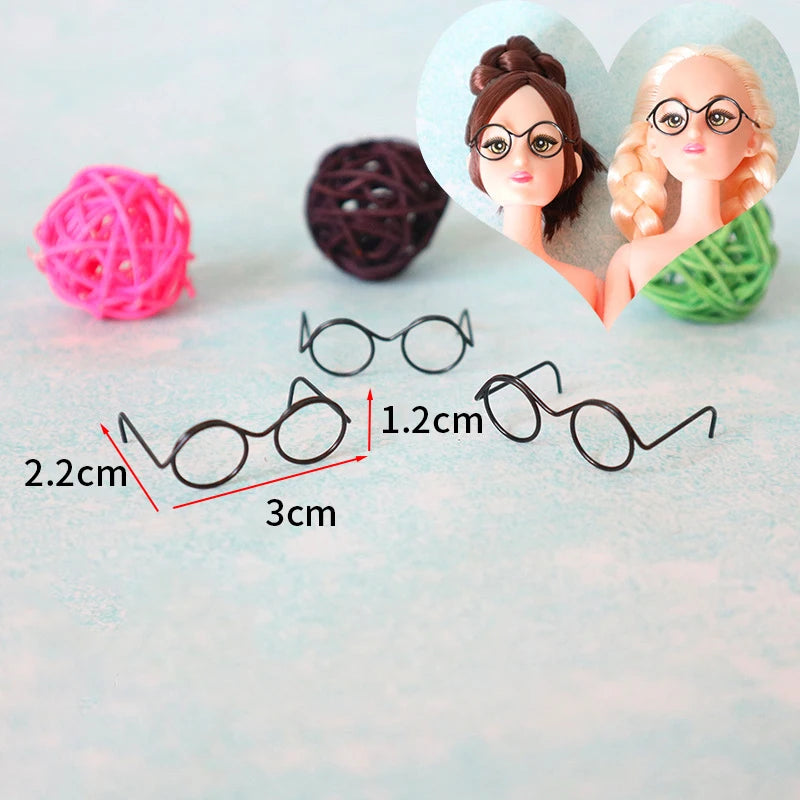 Five metal round glasses frames for dolls displayed with measurements and craft materials.