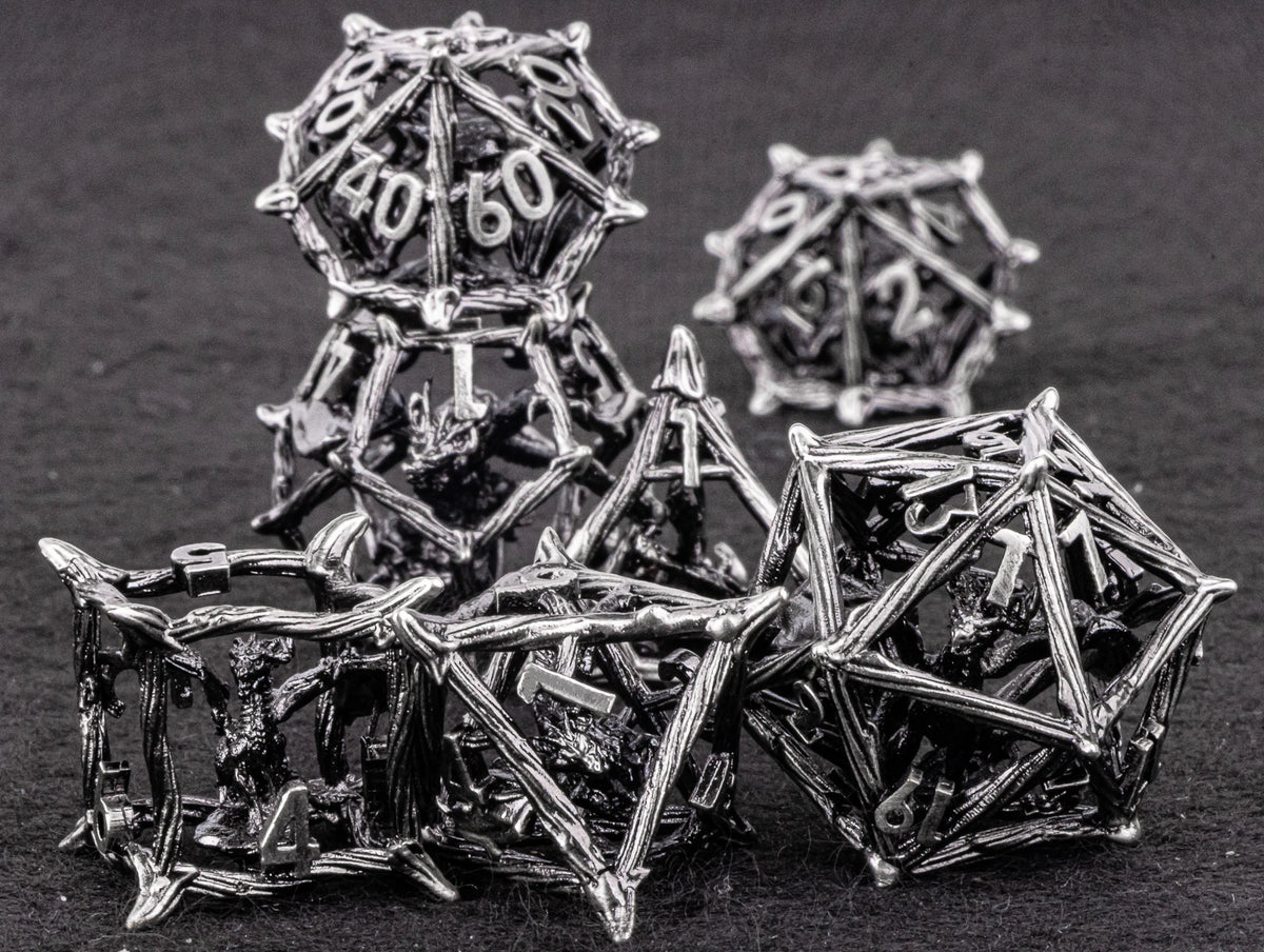 A stack of metallic, geometric dice used for tabletop role-playing games